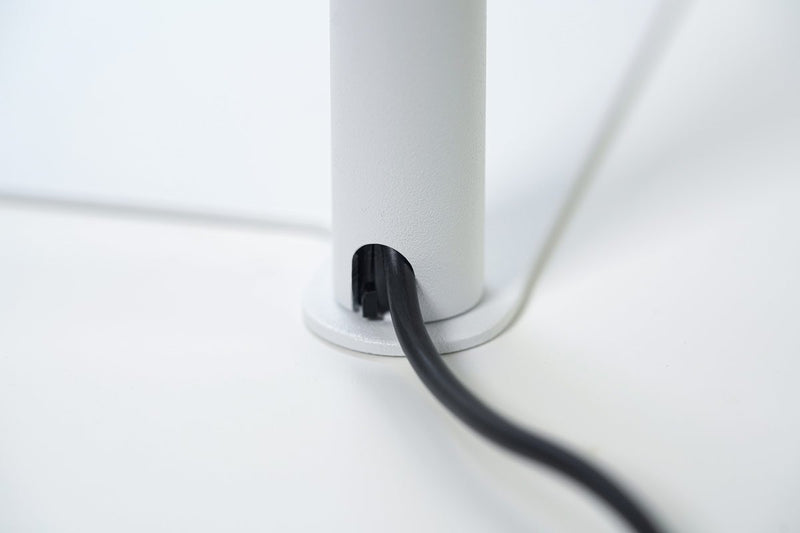 White ONF Flat Nano+ Stand LED light with adjustable stand, ideal for photography or video lighting setups.