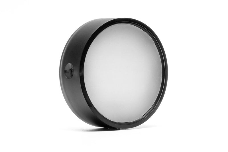 ONF Mist O Puck LED light shining with a soft glow, compact lighting device from ONF for ambient illumination.
