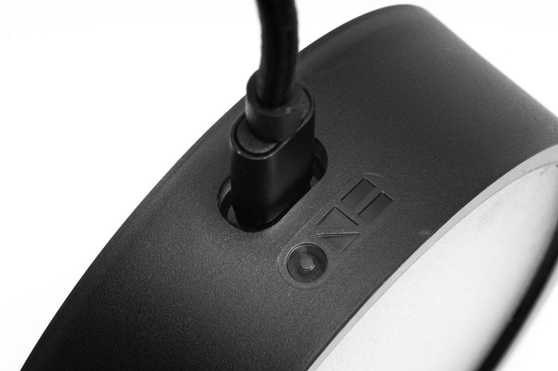 ONF Mist O Puck LED light displaying a sleek, compact lighting device with a modern design and illuminated surface.