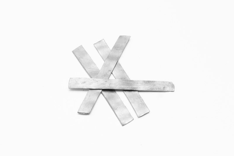 Set of ACW plant weights used as garden accessories to secure and stabilize potted plants and outdoor plant arrangements.
