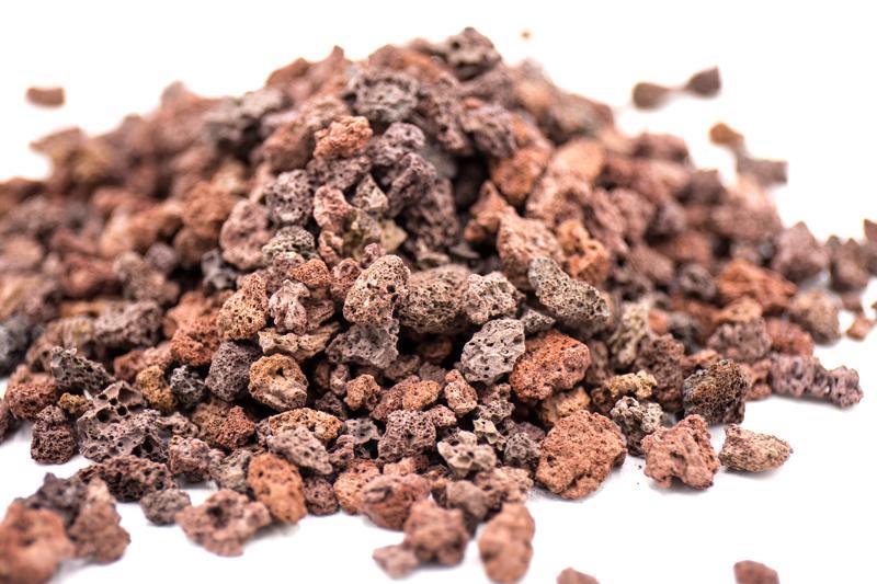Red crushed lava gravel substrate by SB, showing textured, vibrant red volcanic rock ideal for aquariums and garden decor.