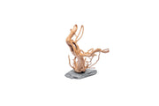 Natural spiderwood driftwood piece displayed on slate surface, showcasing its intricate shape and organic texture.