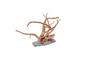 Unshardscape driftwood spiderwood piece resting on a slate surface, showcasing natural, intricate wood textures and organic shapes.