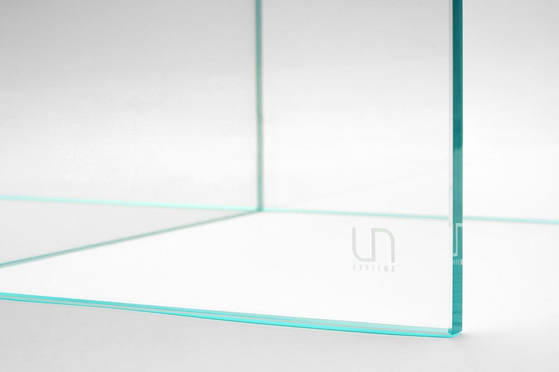 Ultum Nature Systems UNS Glass Aquarium Stand showing a sturdy glass stand designed to support a fish tank in a modern home setting