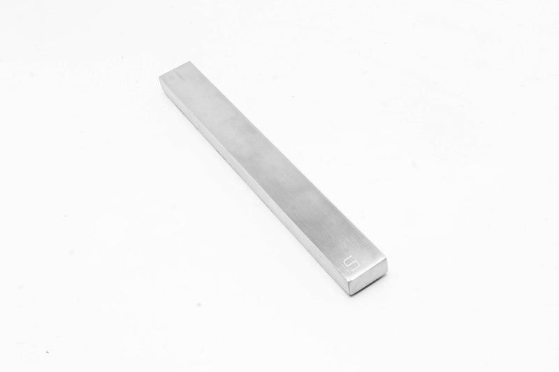 UNSTOOLS UNS Magnetic Tool Bar accessory with magnetic strips for organizing tools on a workbench or wall.