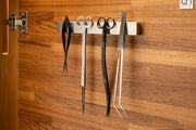 UNSTOOLS UNS Magnetic Tool Bar accessory with magnetic strips holding metal tools and accessories on a work surface.