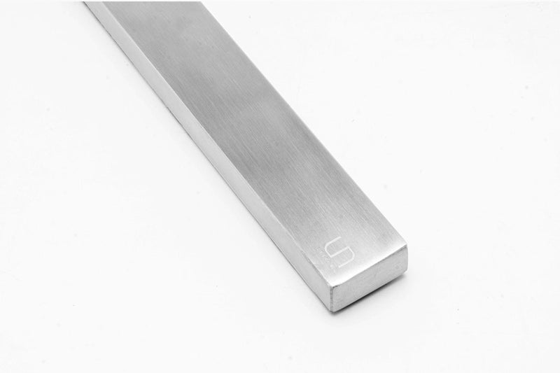 UNSTOOLS UNS Magnetic Tool Bar with magnetic strips for organizing tools, mounted on a wall for easy access and storage.