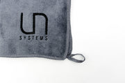 Ultum Nature Systems UNS microfiber towel for accessories, showing its soft, lightweight, and quick-drying fabric in a close-up view.
