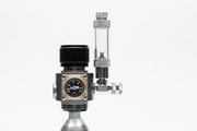 UNSCO2 Mini Dual Stage CO2 Regulator showing pressure gauges and control knobs for precise gas regulation.