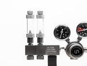 UNS Pro Dual Stage CO2 Regulator attached to a CO2 tank, featuring pressure gauges and adjustment knobs for precise gas control.